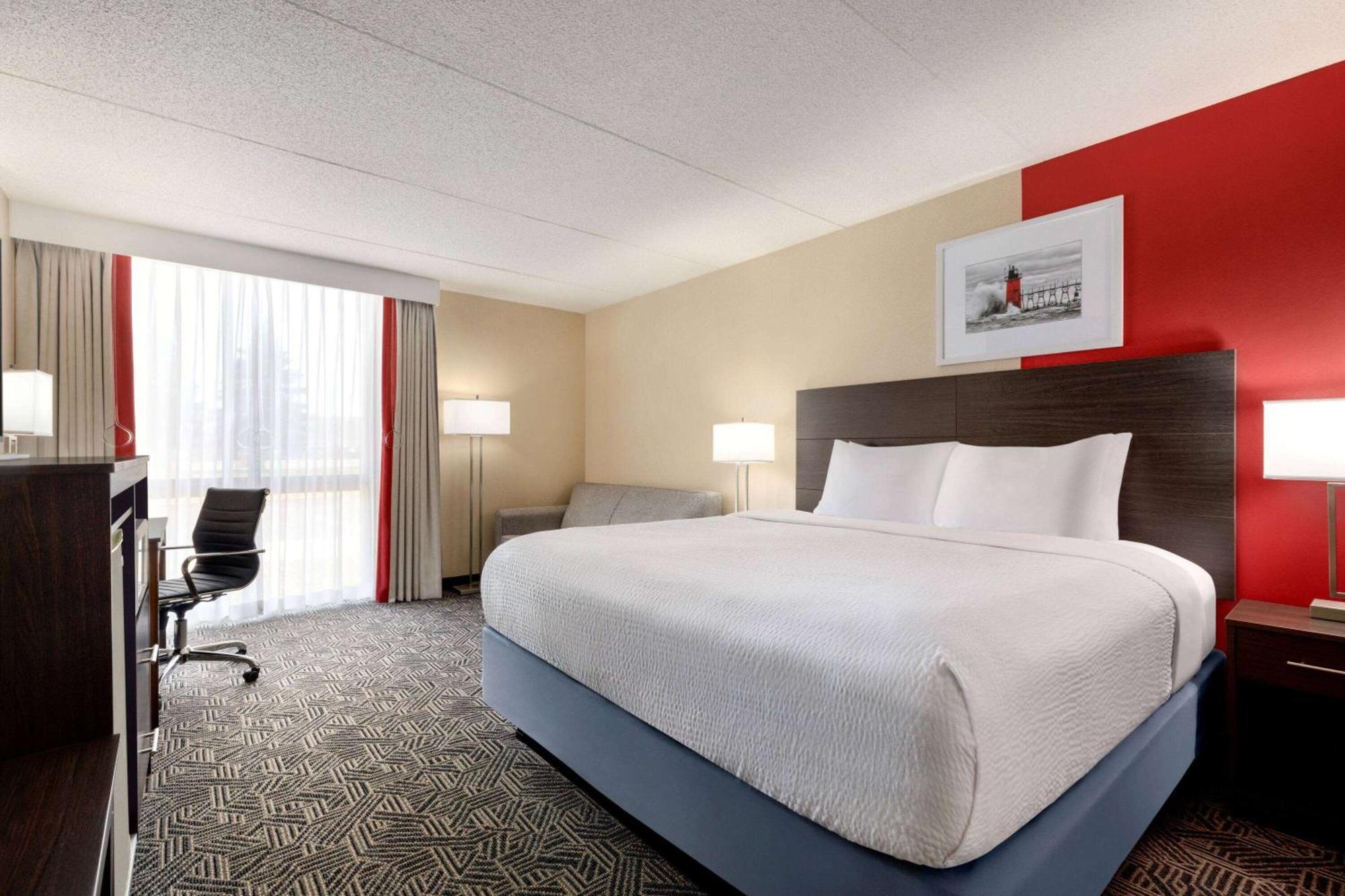 Hotel Ramada By Wyndham Alpena Esterno foto