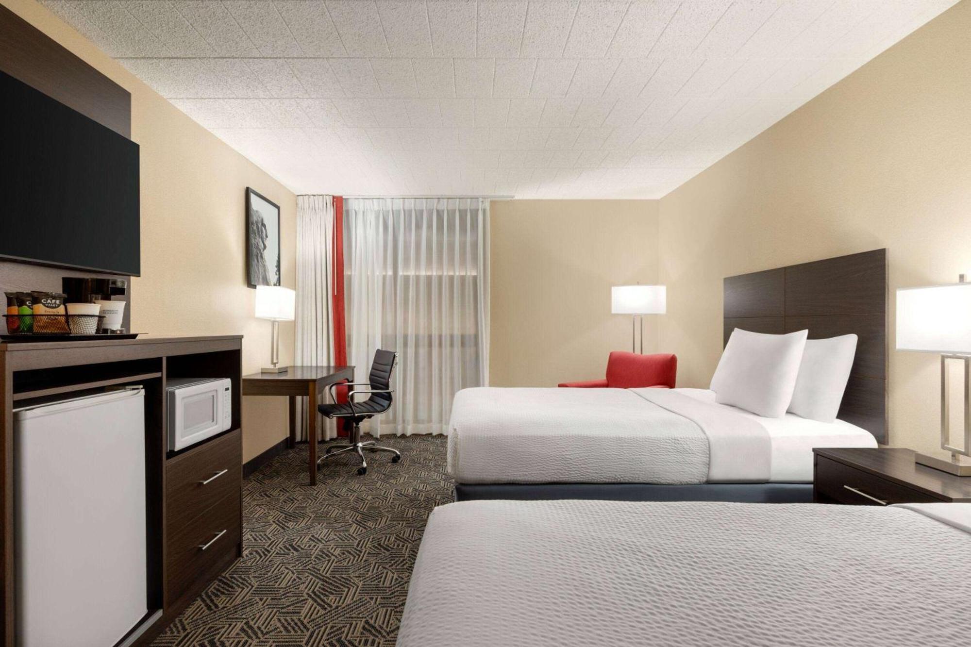 Hotel Ramada By Wyndham Alpena Esterno foto